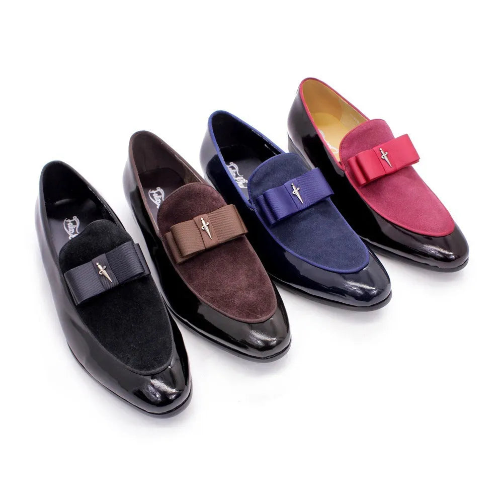 Men's glossy black patent leather low-top shoes with a tassel detail on a rubber sole.
