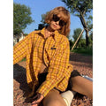 Yellow plaid cardigan shirt with loose fit and polyester blend fabric