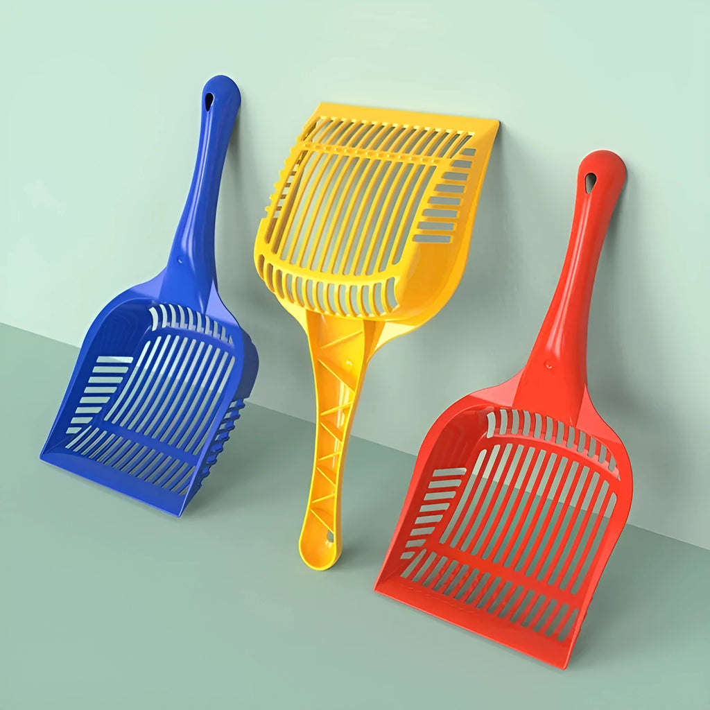 Red plastic cat litter scoop with deep sifting bowl and handle next to a yellow scoop.