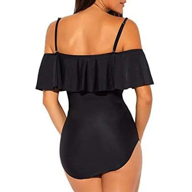 Black one-piece swimsuit with ruffled cut-out tube top design on a mannequin.