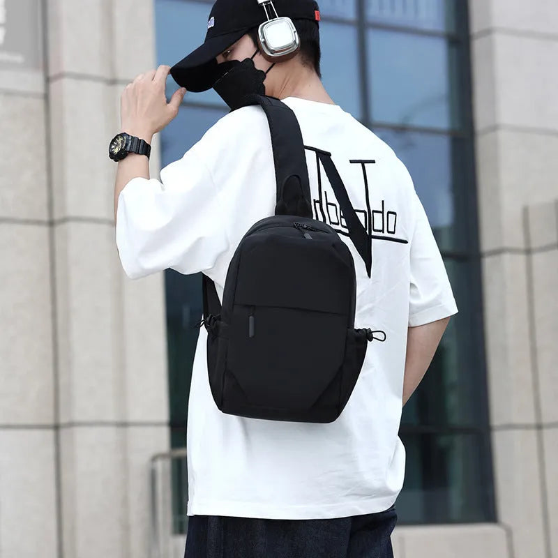 Men's waterproof chest bag in grey showing dimensions and shoulder strap