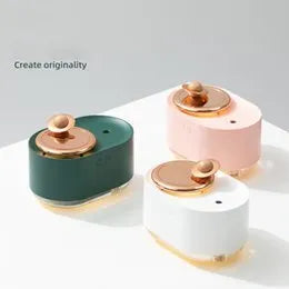 Planet-shaped rotating humidifier with night light in green, pink or white colours showing USB charging port