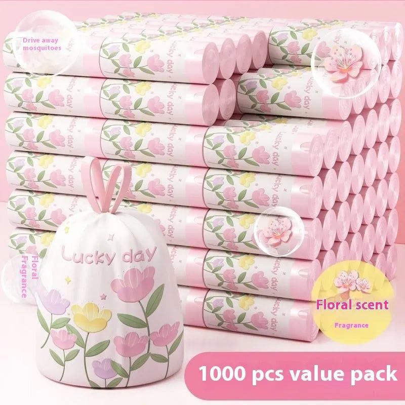 Pink degradable garbage bag with bold drawstring, scented with argy wormwood for mosquito repellent, size 44cm by 48cm.