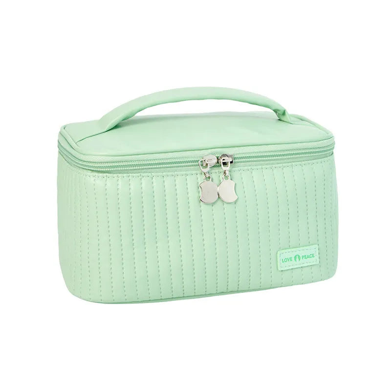 Open-top cake style makeup bag in soft PU leather, shown in one of six solid colour options.