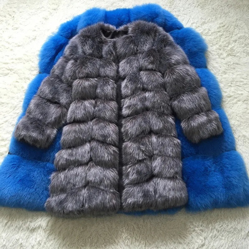 Women's long black artificial fur winter coat with regular sleeves on a hanger.