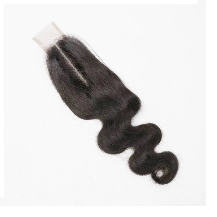 Straight style human hair wig in natural colour displayed on a stand, showing long lengths.