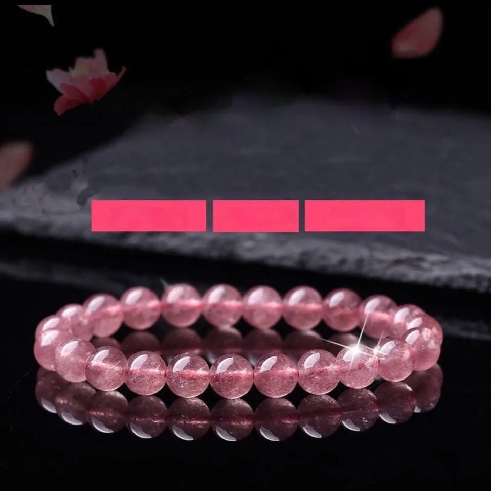 Natural strawberry quartz bracelet for women with polished beads in 6mm, 8mm, or 10mm size options.
