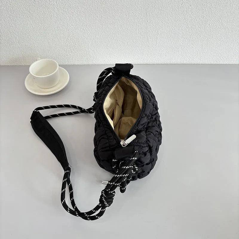 Women's lightweight nylon pillow-shaped messenger bag with a crossbody strap in six colour options.