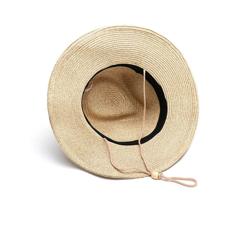 Men's foldable straw sun hat with a wide brim shown in a beige colour.