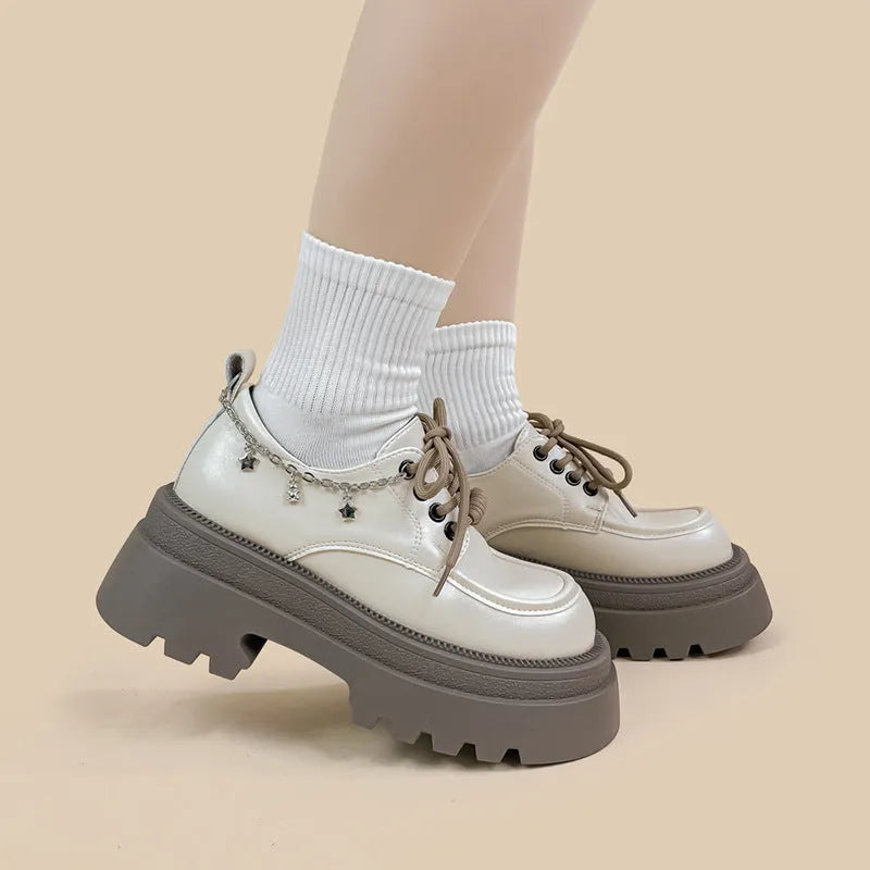 White women's platform Mary Jane shoes with chunky heel and front lace-up detail.