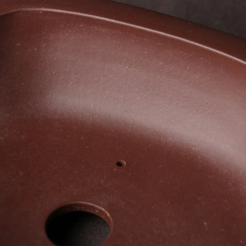 Handmade purple clay bonsai basin with traditional Chinese plain design measuring 25x20x7cm