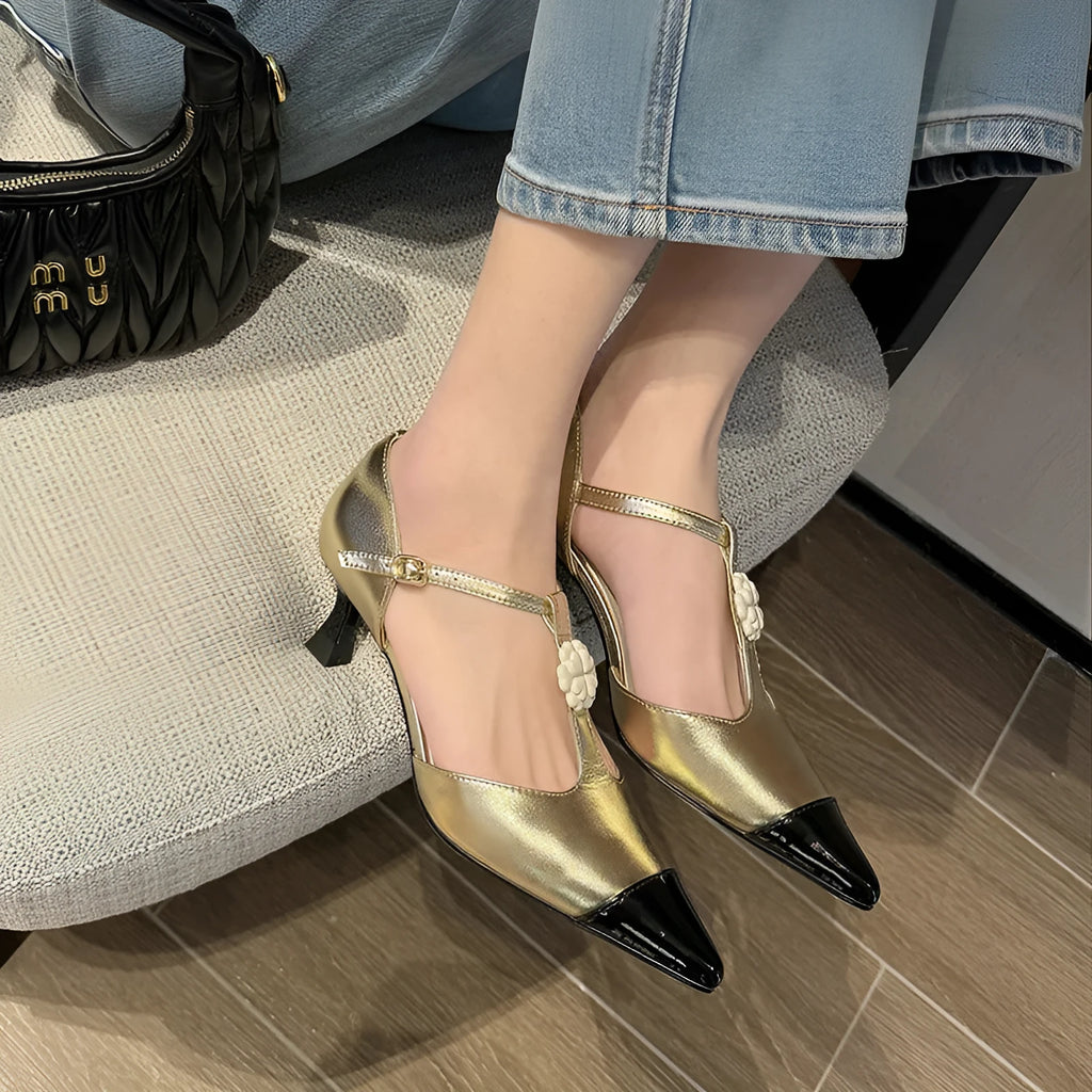 Women's black stiletto heel with pointed toe, floral detail, and a shallow mouth cut.