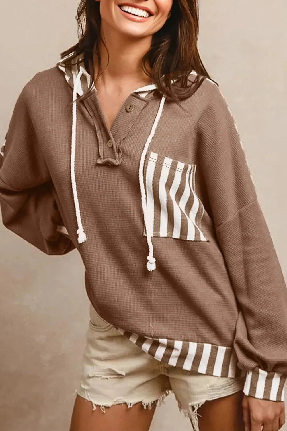 Straw yellow waffle texture ladies hoodie with striped patchwork and button neck closure
