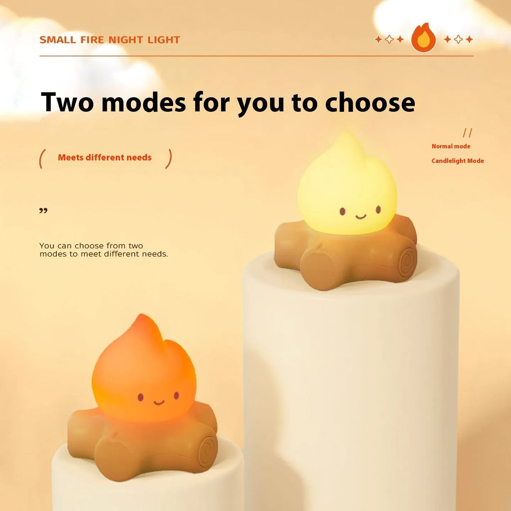 Silicone small fire pile shaped cartoon night light with yellow glow on a surface.
