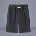 Solid colour cotton linen cropped summer pants with a drawstring waistband on a hanger.