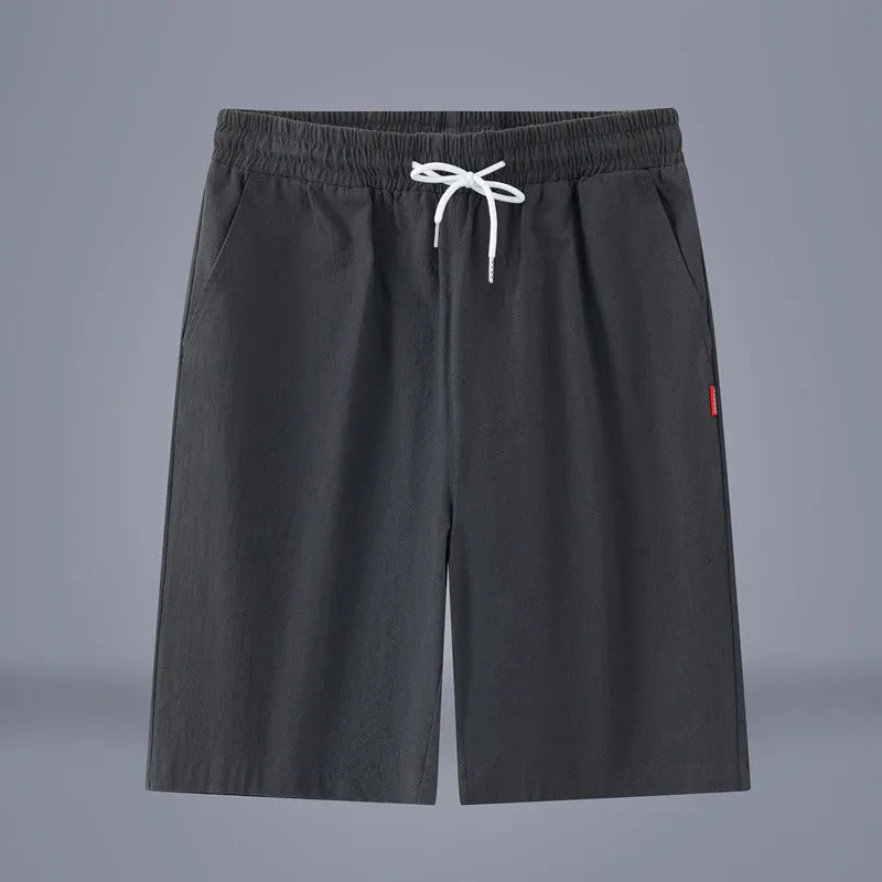 Solid colour cotton linen cropped summer pants with a drawstring waistband on a hanger.