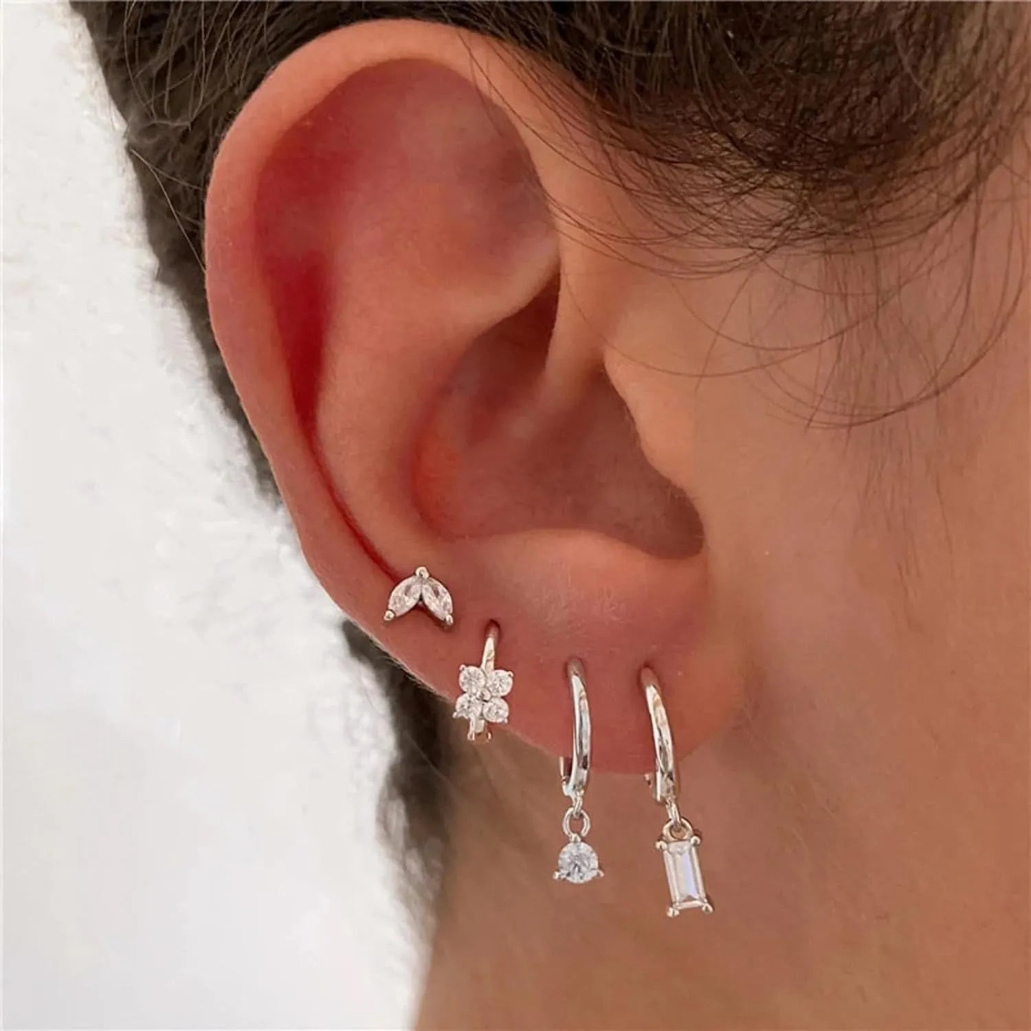 Copper geometric earring set with zircon details in gold or silver electroplated finish showing star, ellipse, ring and quadrilateral designs