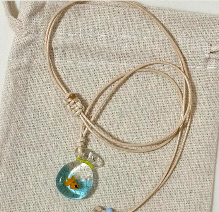 Women's coloured glaze skirt pendant necklace with joker design on cotton linen chain