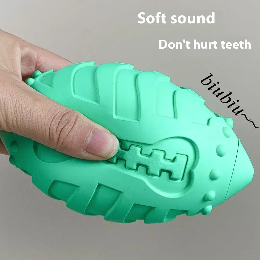 Light green rugby-shaped rubber dog toy with bite-resistant texture for chewing and interactive play