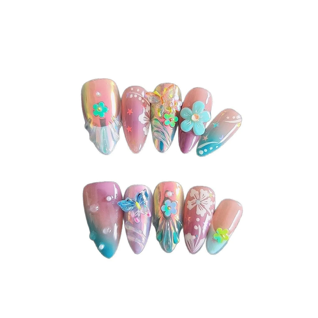 Handmade 3D nail art sculpture of embossed flowers and butterflies on an almond-shaped base.