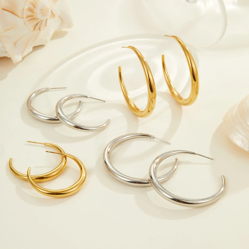 Geometric round hoop earrings in gold and steel finishes available in large and small sizes
