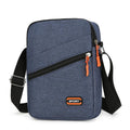 Lightweight Oxford cloth crossbody commuter bag in a solid colour with contrast detail.