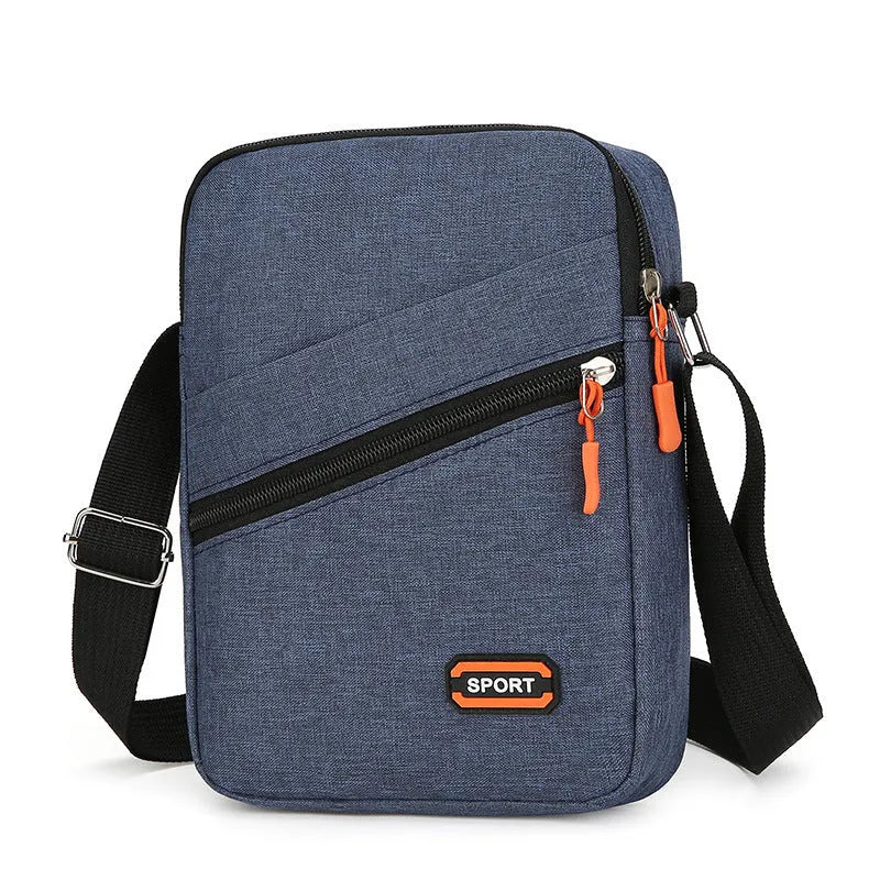 Lightweight Oxford cloth crossbody commuter bag in a solid colour with contrast detail.