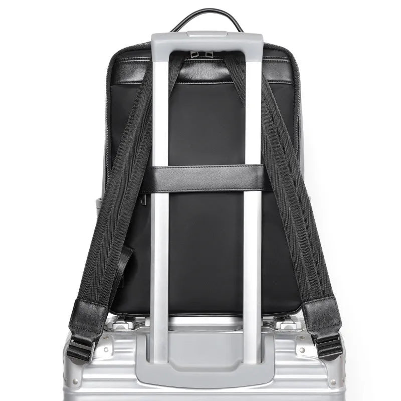 Black genuine leather men's computer backpack with large 55L capacity shown from a side angle.