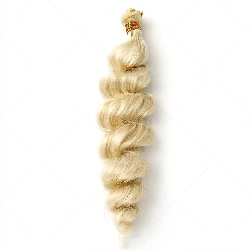 Golden synthetic hair weft wig showing long, straight strands in a golden yellow colour.