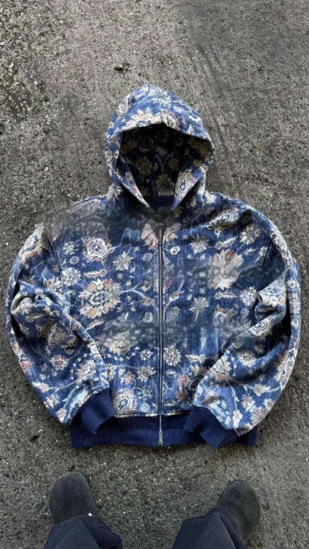 Man wearing a blue loose-fit hooded zip-up casual coat for autumn.