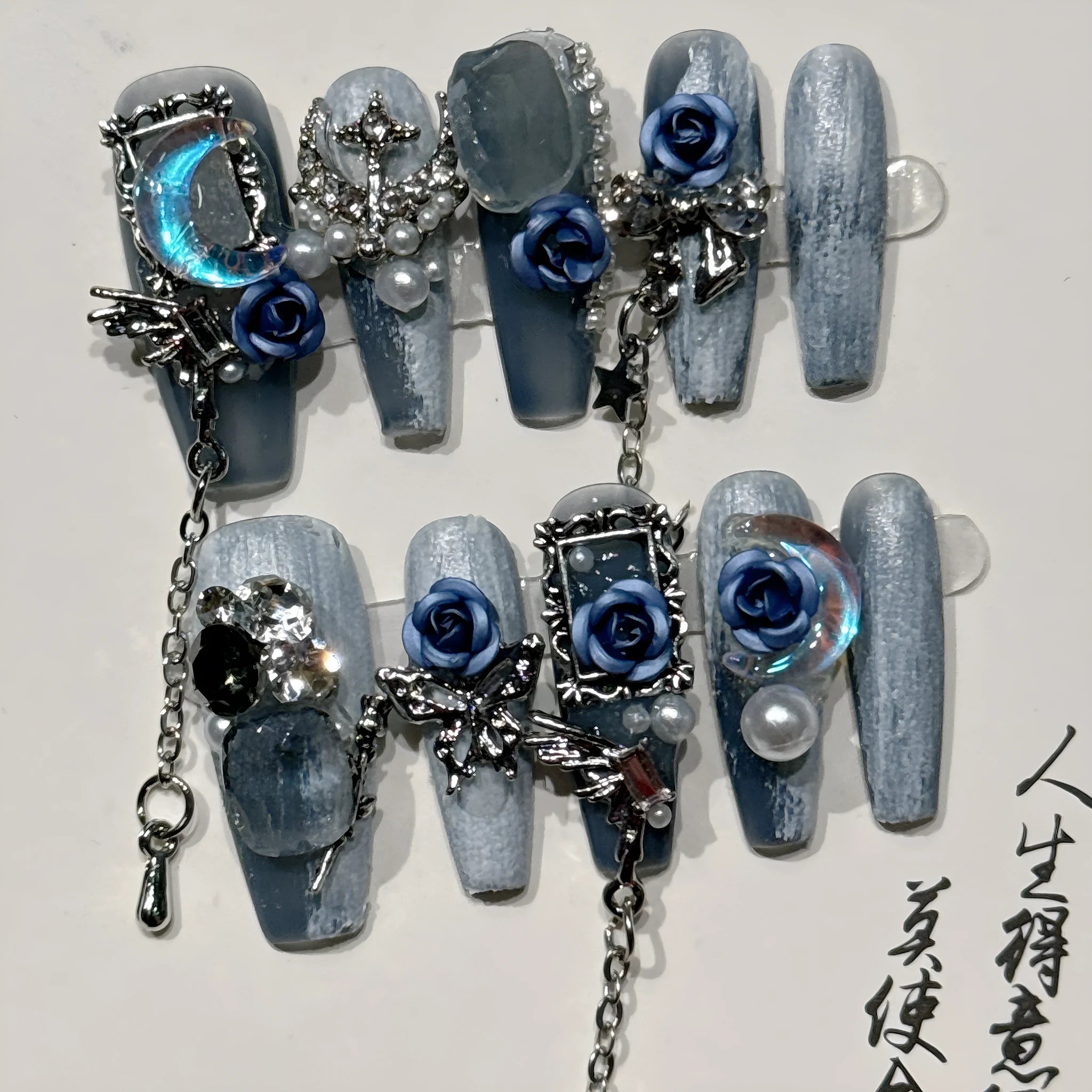 Heavy industry blue nail stickers with twinkling rose and tulip patterns for evening manicures