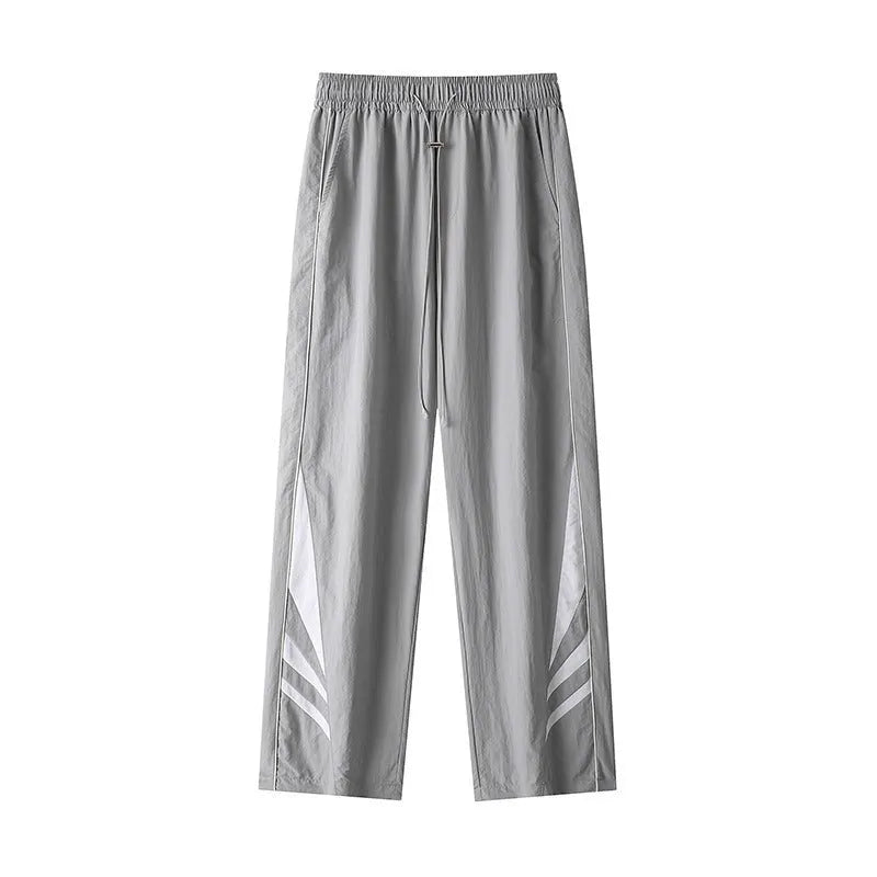 Men's straight cut loose fit casual trousers in black or grey, laid flat.