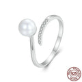 Shell pearls ring with S925 sterling silver construction and adjustable open loop design featuring natural pearl accent
