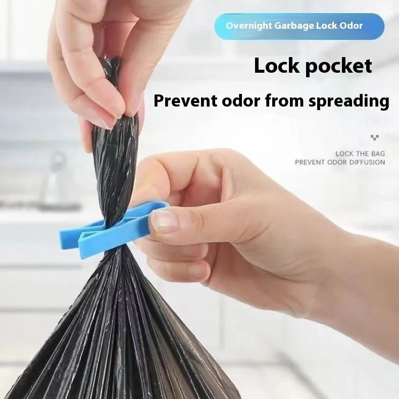 Transparent plastic non-slip clip for holding a garbage bag on the rim of a bin.