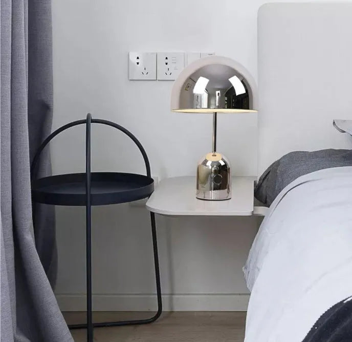 Mushroom table lamp with metal base in Rose Gold finish on wooden table