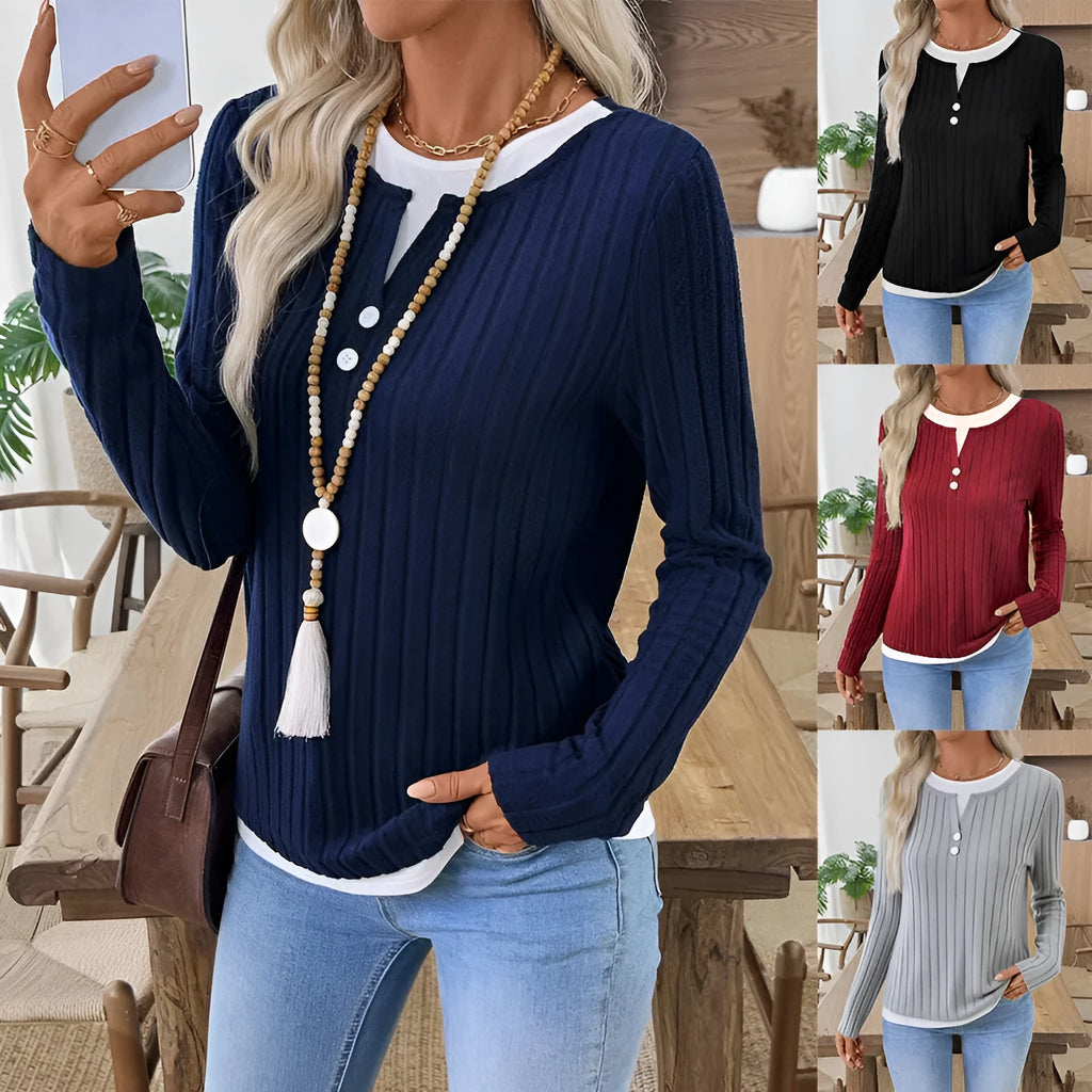 Women's black fake two-piece pullover sweater with button front and round neck on a model.