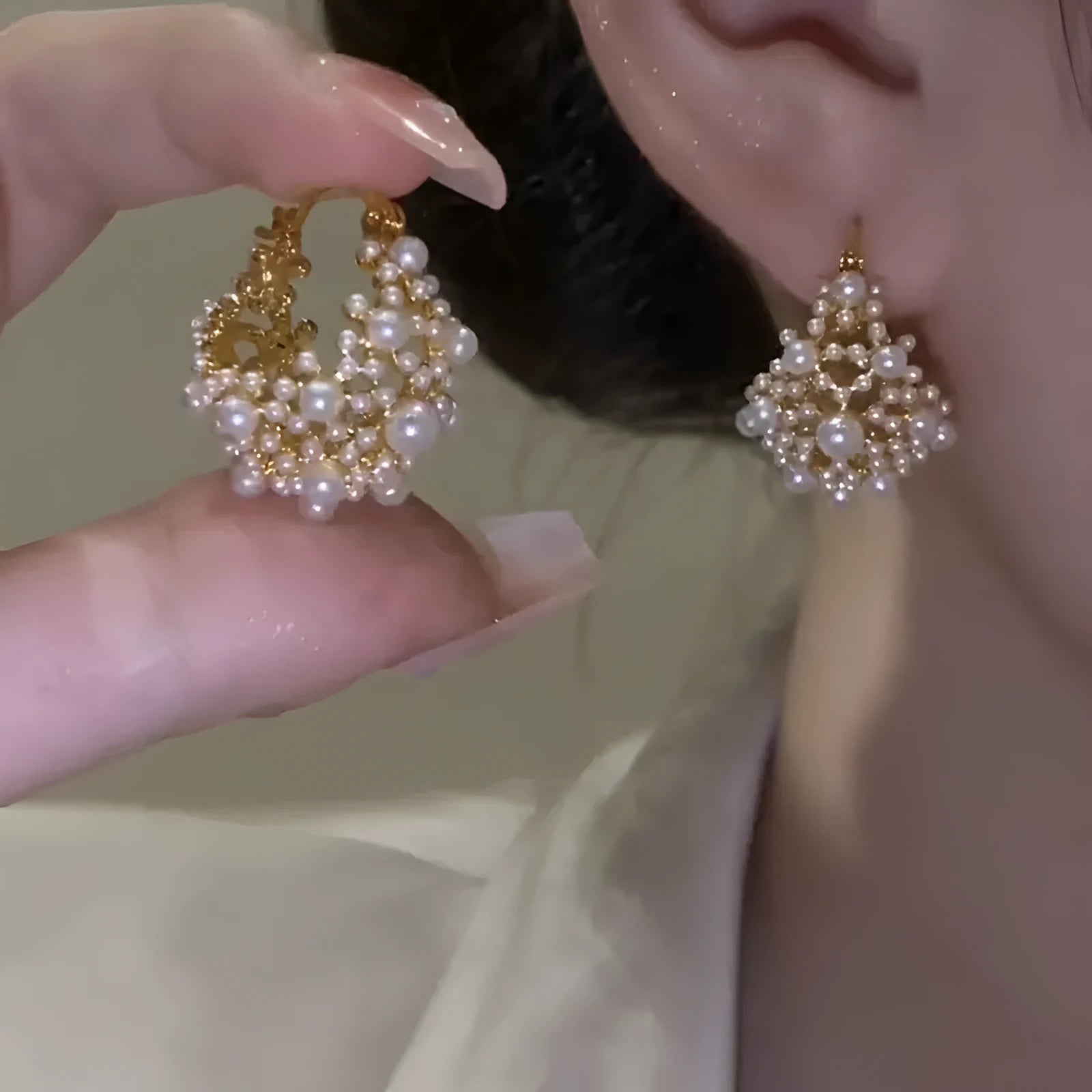 Women's gold flower basket earrings with small beads and pearl inlay detailing on copper