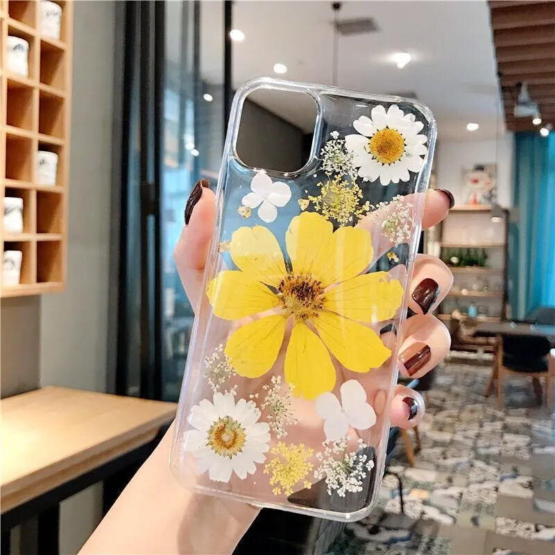 Pink and yellow floral design TPU back cover case for iPhone on a white background.