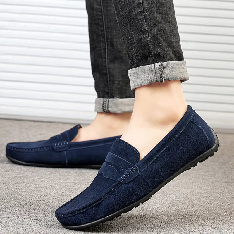 Men's brown suede loafers with round toe and flat rubber sole
