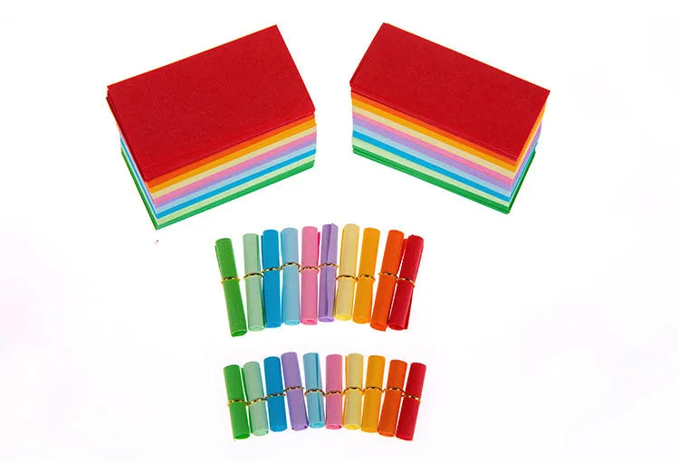 Colourful assortment of small rolled paper scrolls with central holes for drift bottle messages