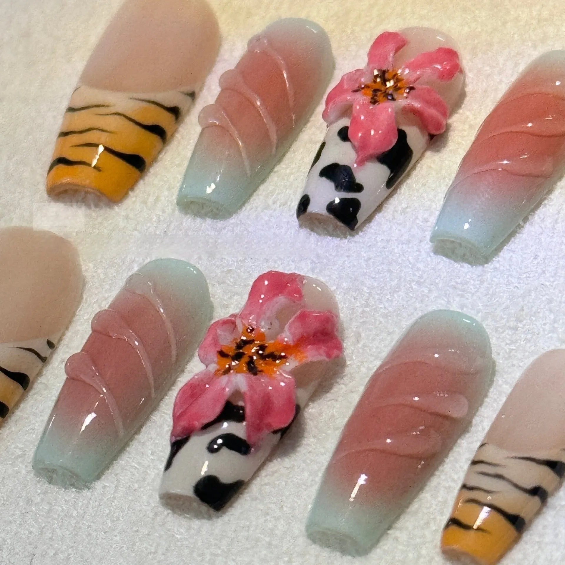 Zebra pattern nail art set with hand-carved lilies, floral and leopard prints in sizes XS, S, M, L.