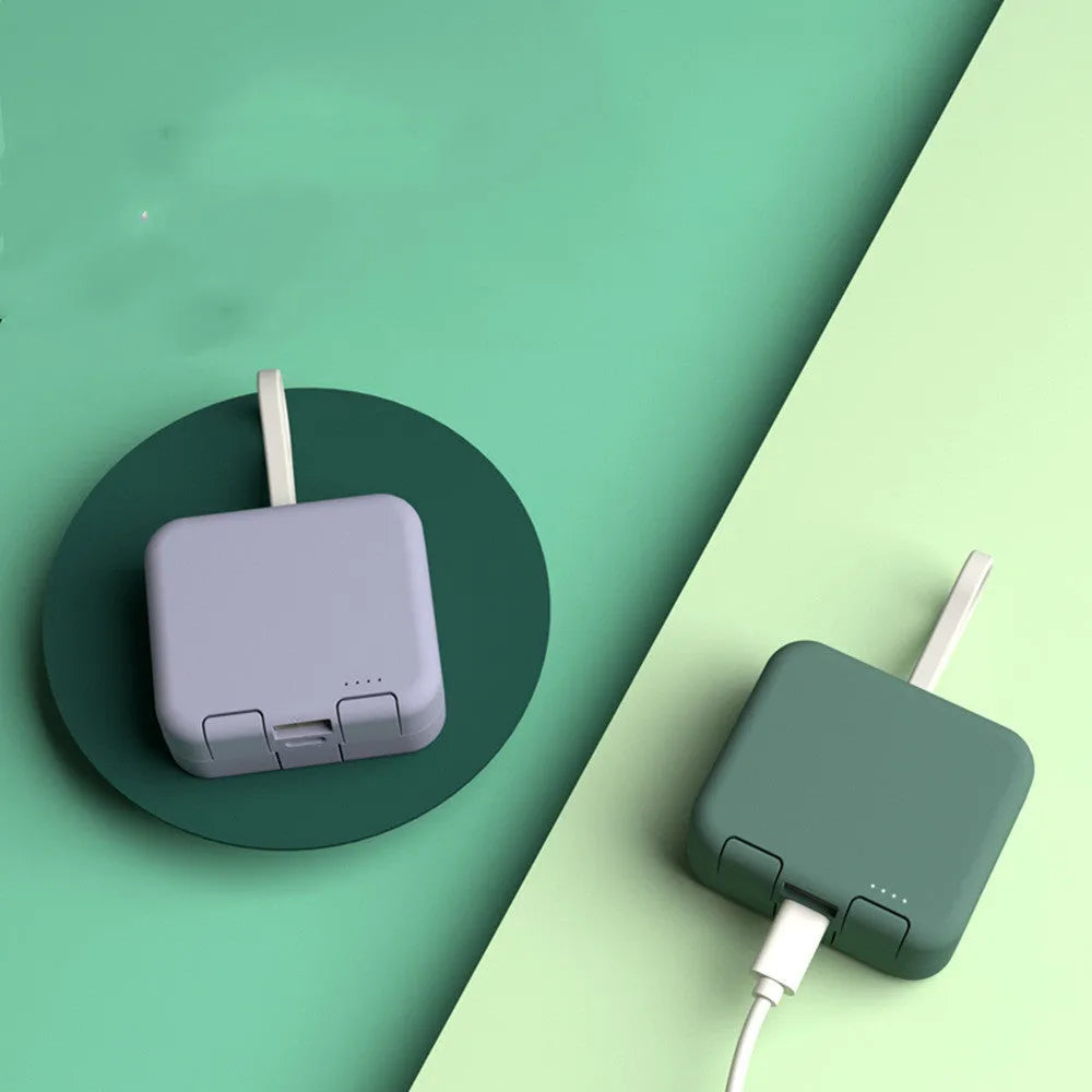 Handbag clip-on power bank in blue showing phone stand function and Type-C/Lightning ports.