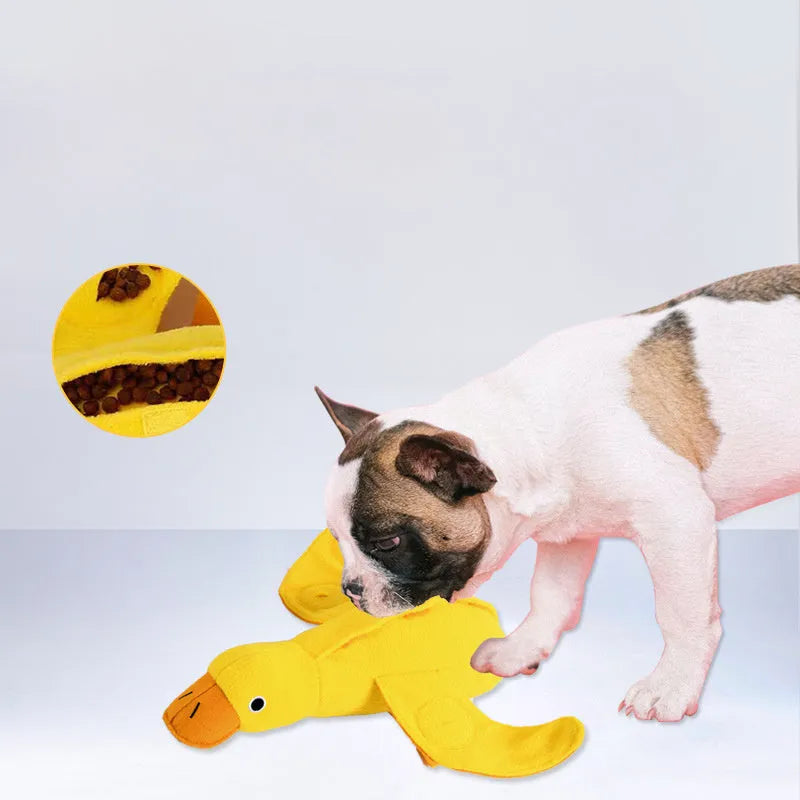 Yellow teddy dog toy with central duck doll, featuring a squeaker and treat leak compartment.