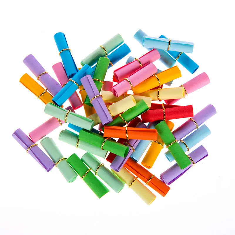 Colourful assortment of small rolled paper scrolls with central holes for drift bottle messages