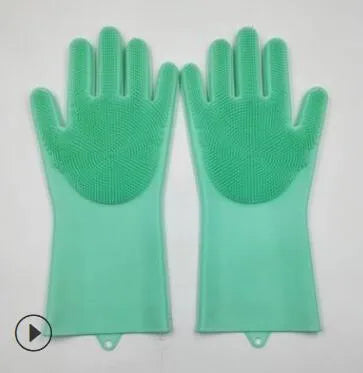 Blue silicone cleaning gloves with textured scrubbing patterns on fingers and palms.