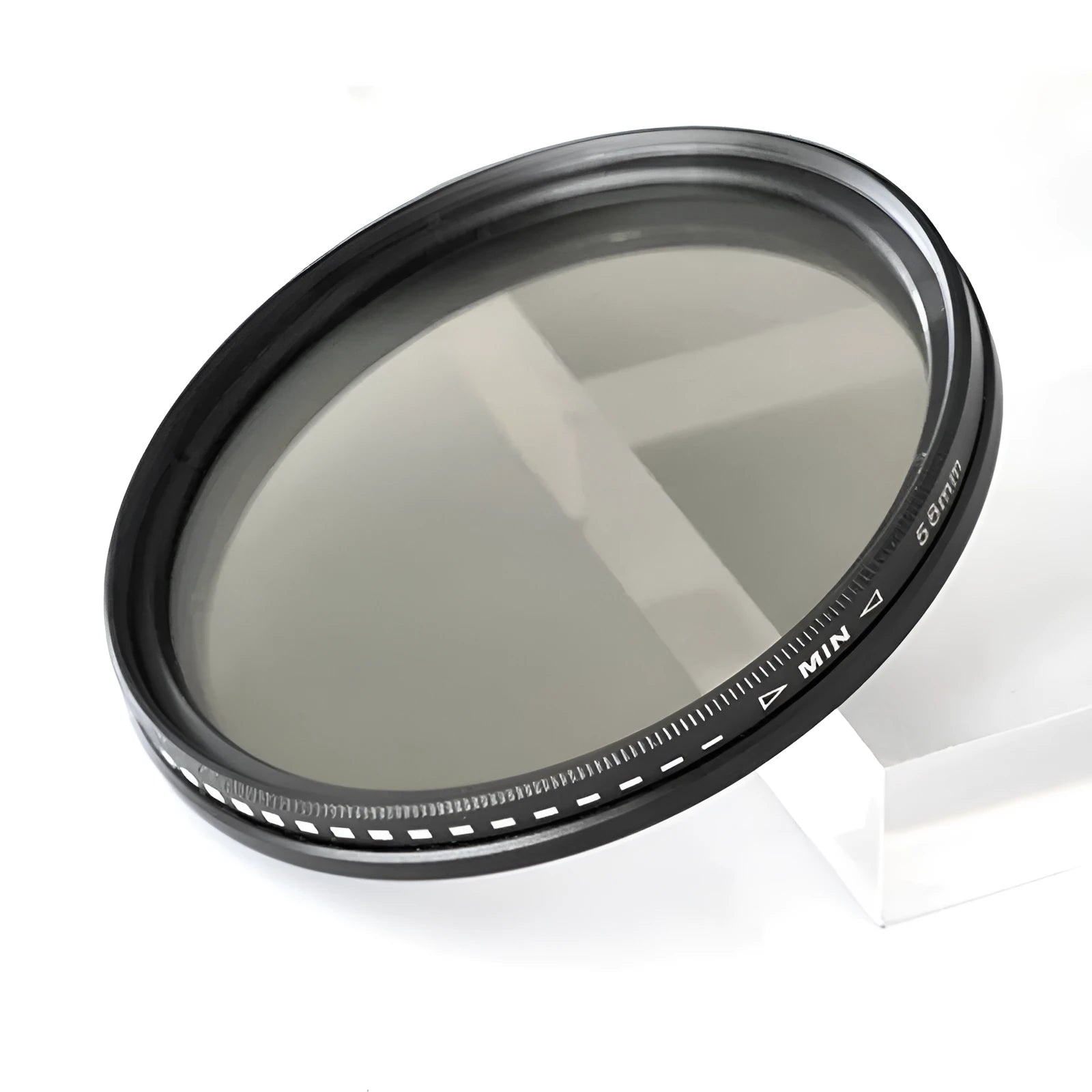 Set of four neutral density camera lens filters with multiple thread size adapters
