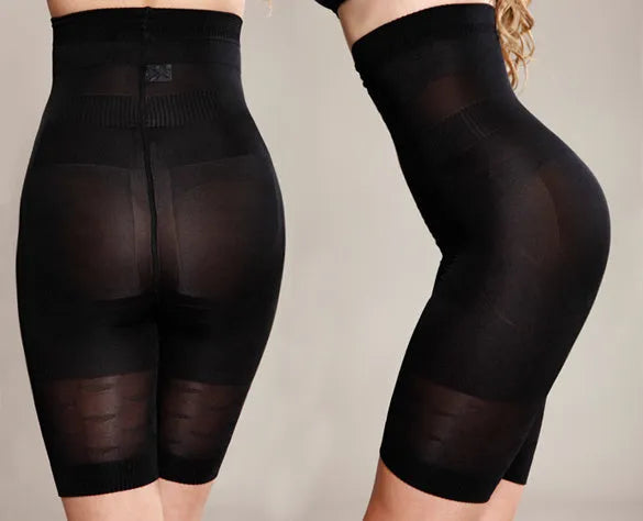 Black seamless high waist shapewear shorts for women laid flat, showing tummy control panel.