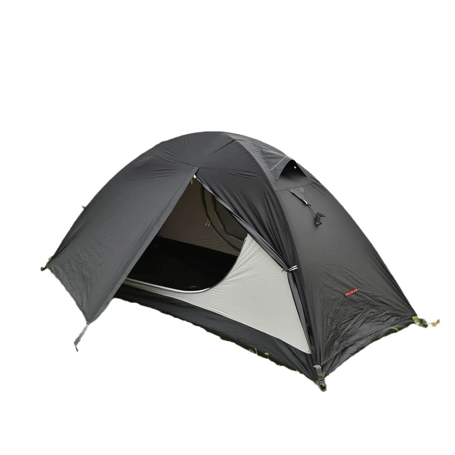Red single person dome tent with aluminium poles pitched outdoors, showing double-layer construction.