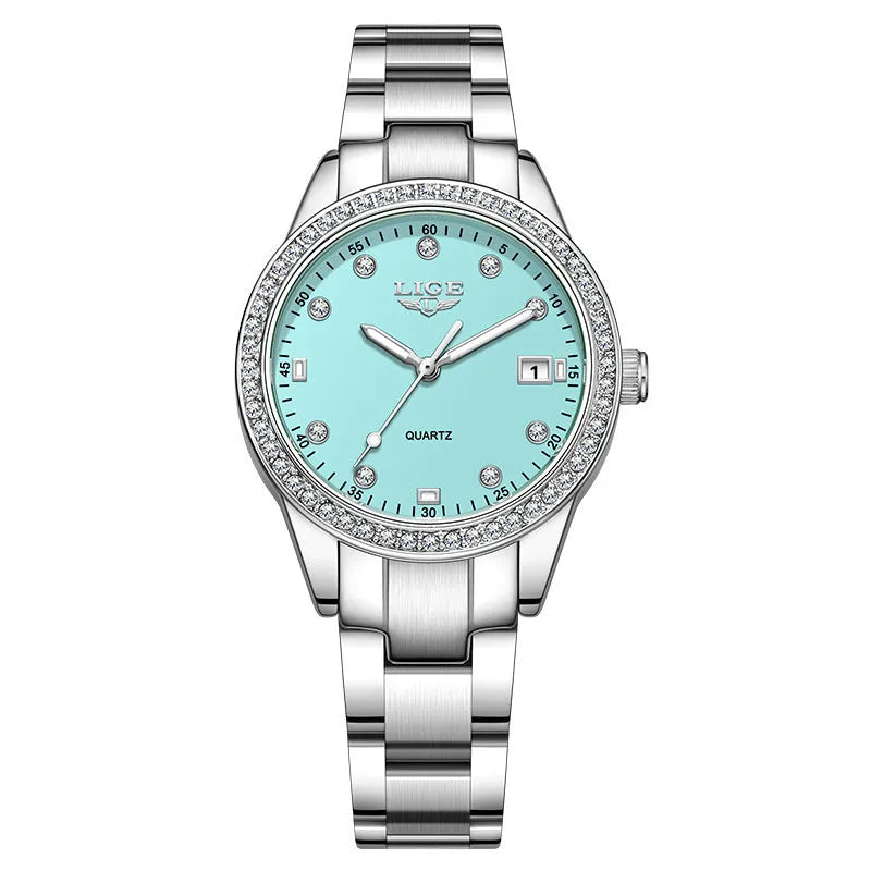 Silver fashion watch with diamond-encrusted round dial and luminous hands on a stainless steel strap.