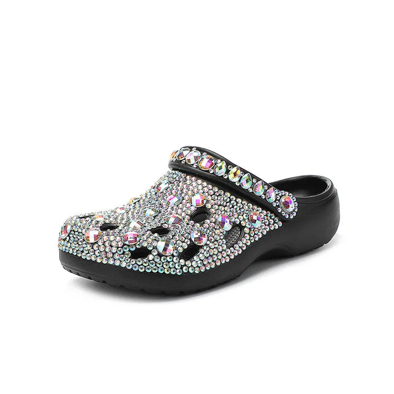 Black women's platform sandals with rhinestone decoration and multiple air holes on a white background.